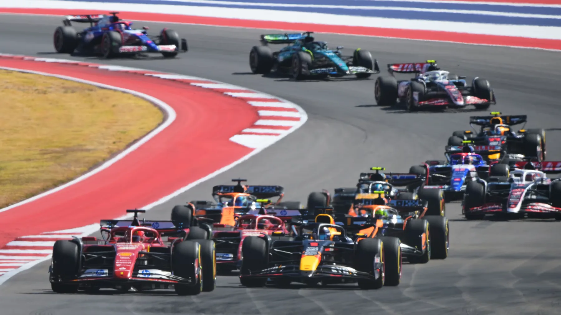 Formula 1 cars racing through a corner